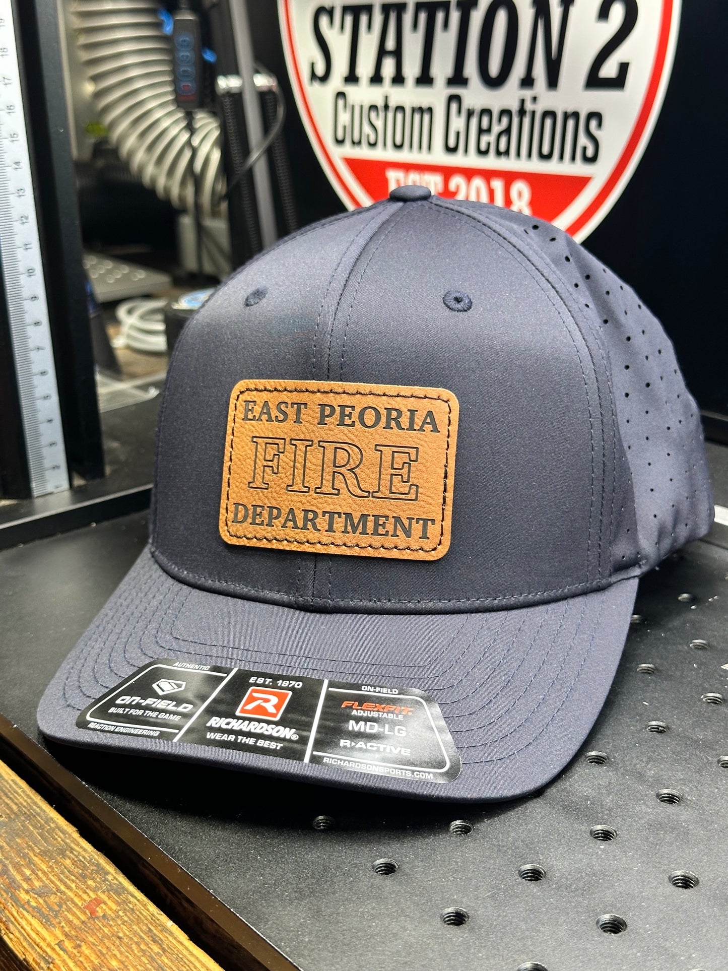 Grey Richardson 632 laser perf hat with engraved East Peoria Fire Department patch