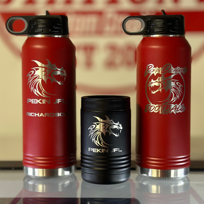 Red water bottles with a logo on a reflective surface in front of a 'Station 2' sign.
