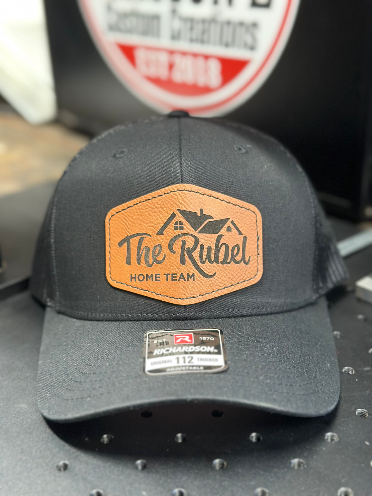 Charcoal Richardson 112 with engraved The Rubel rawhide leatherette patch
