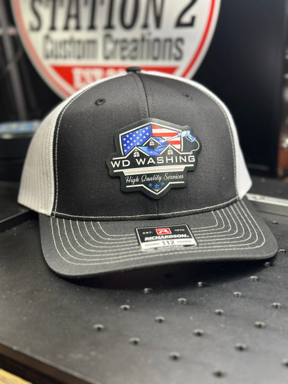 Richardson 112 trucker hat with a full-color printed American flag business logo patch