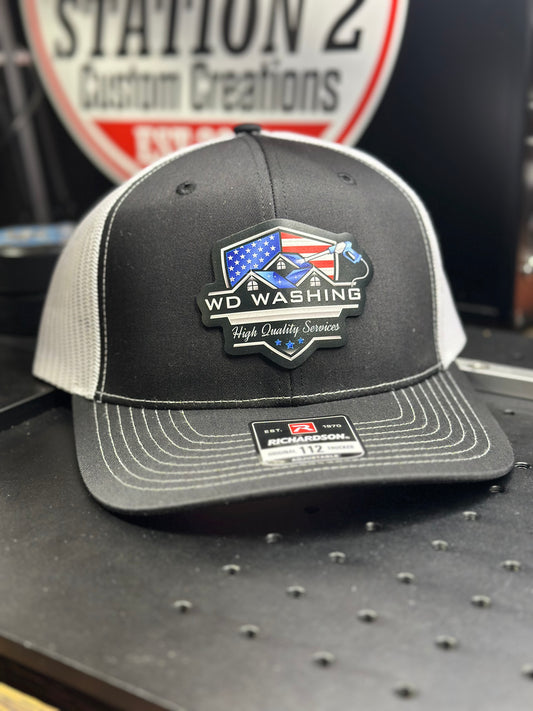Richardson 112 trucker hat with a full-color printed American flag business logo patch