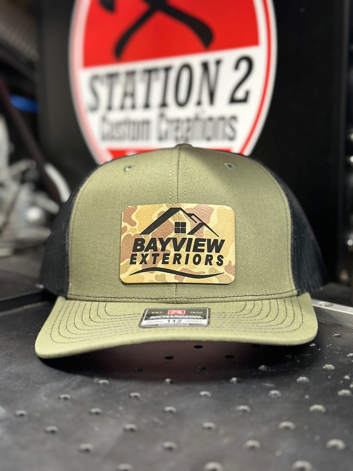 Loden Richardson 112 with engraved Bayview Exteriors olive leatherette patch