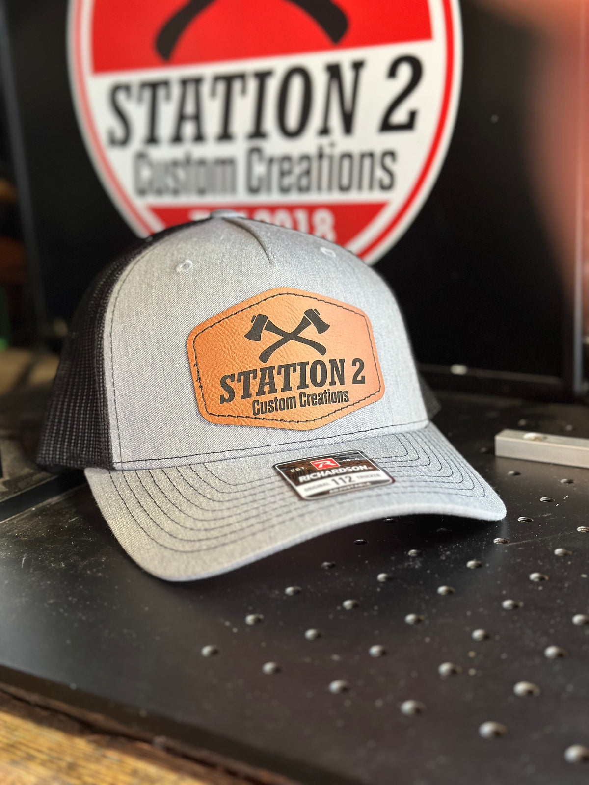 Heather grey Richardson 112FP hat with engraved Station 2 crossed-axes patch
