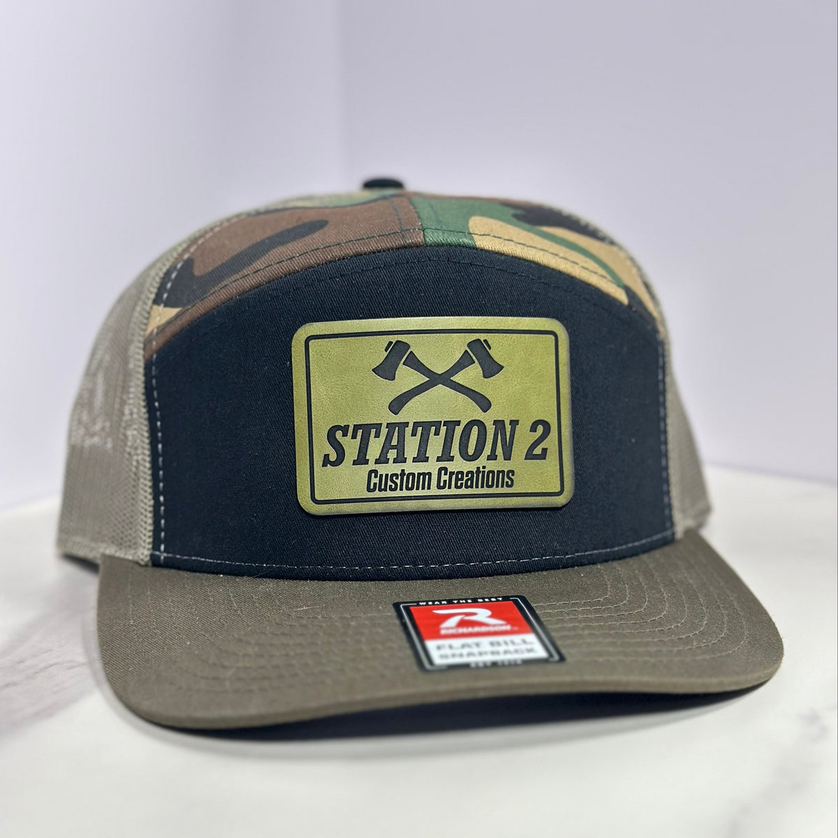 Camo Richardson 168 seven-panel hat with engraved Station 2 olive leatherette patch