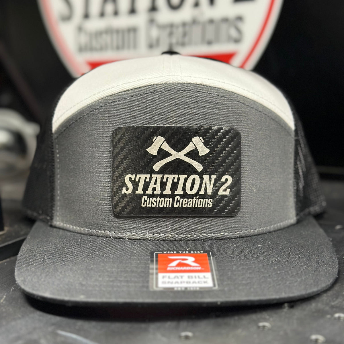 Grey and black Richardson 168 seven-panel hat with engraved Station 2 carbon patch