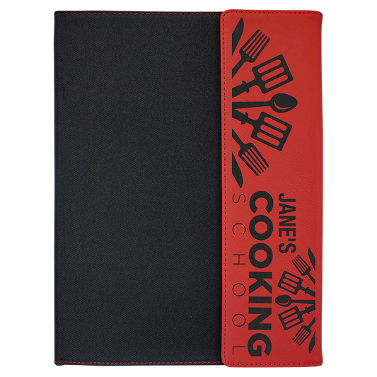 Red and black leatherette portfolio with notepad, engraved with a cooking logo on the cover