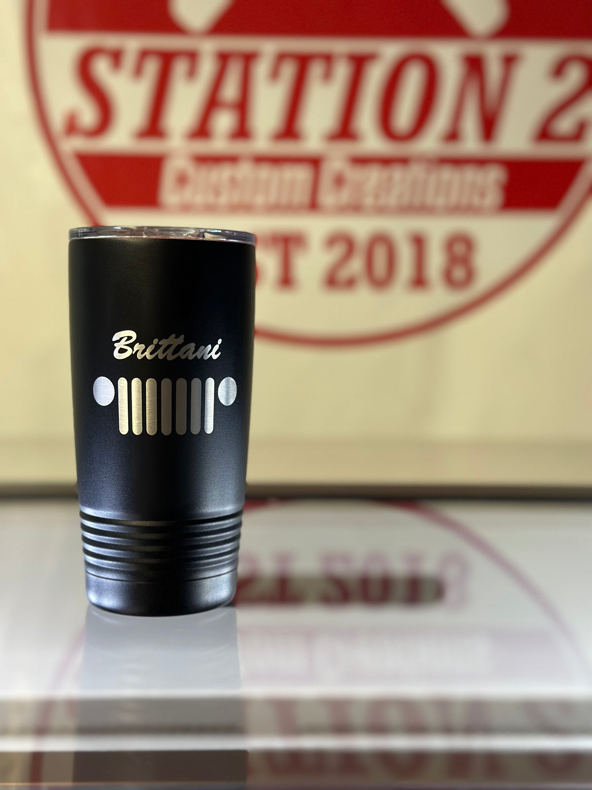 Black 20oz Freedom Trail tumbler engraved with a Jeep-style grille and name