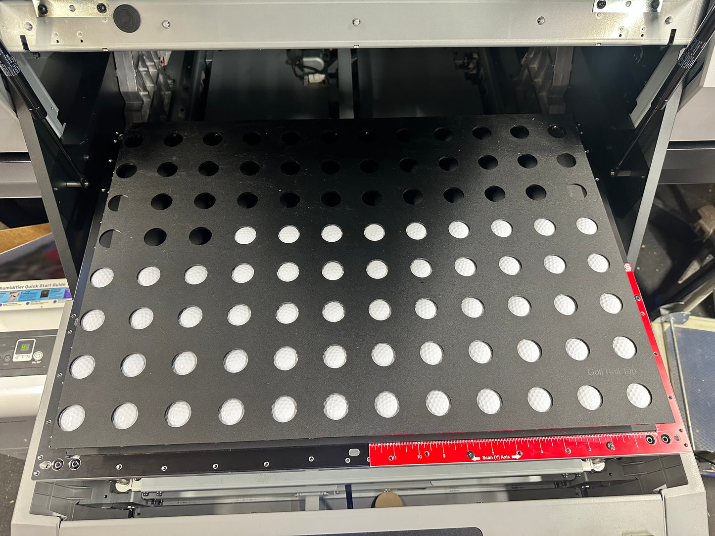 Golf ball jig for the Mimaki UJF-6042 installed on the printer bed